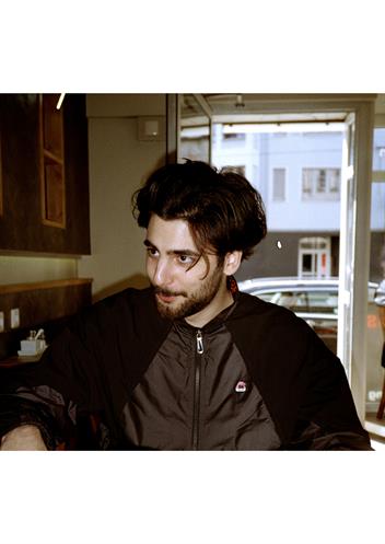 Portrait photo of Hasan Gündogan.